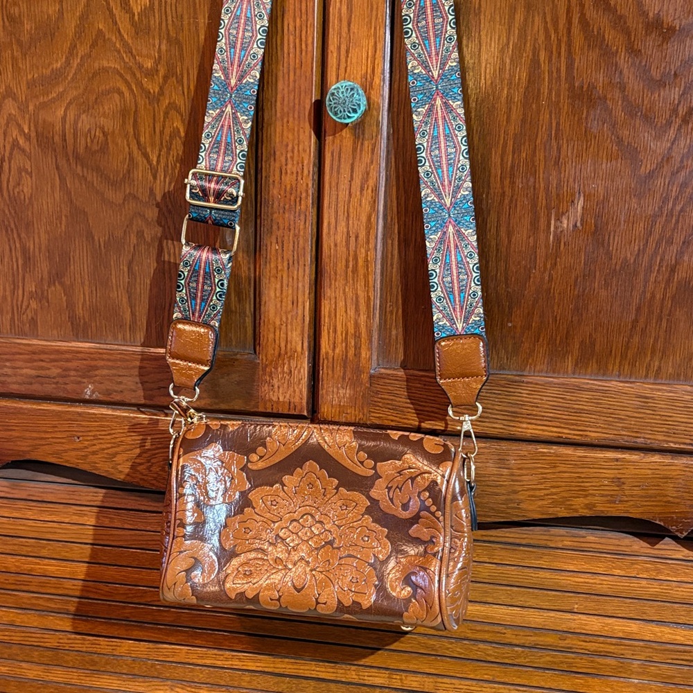 Elegant Tan Embossed Crossbody Bag with Patterned Strap